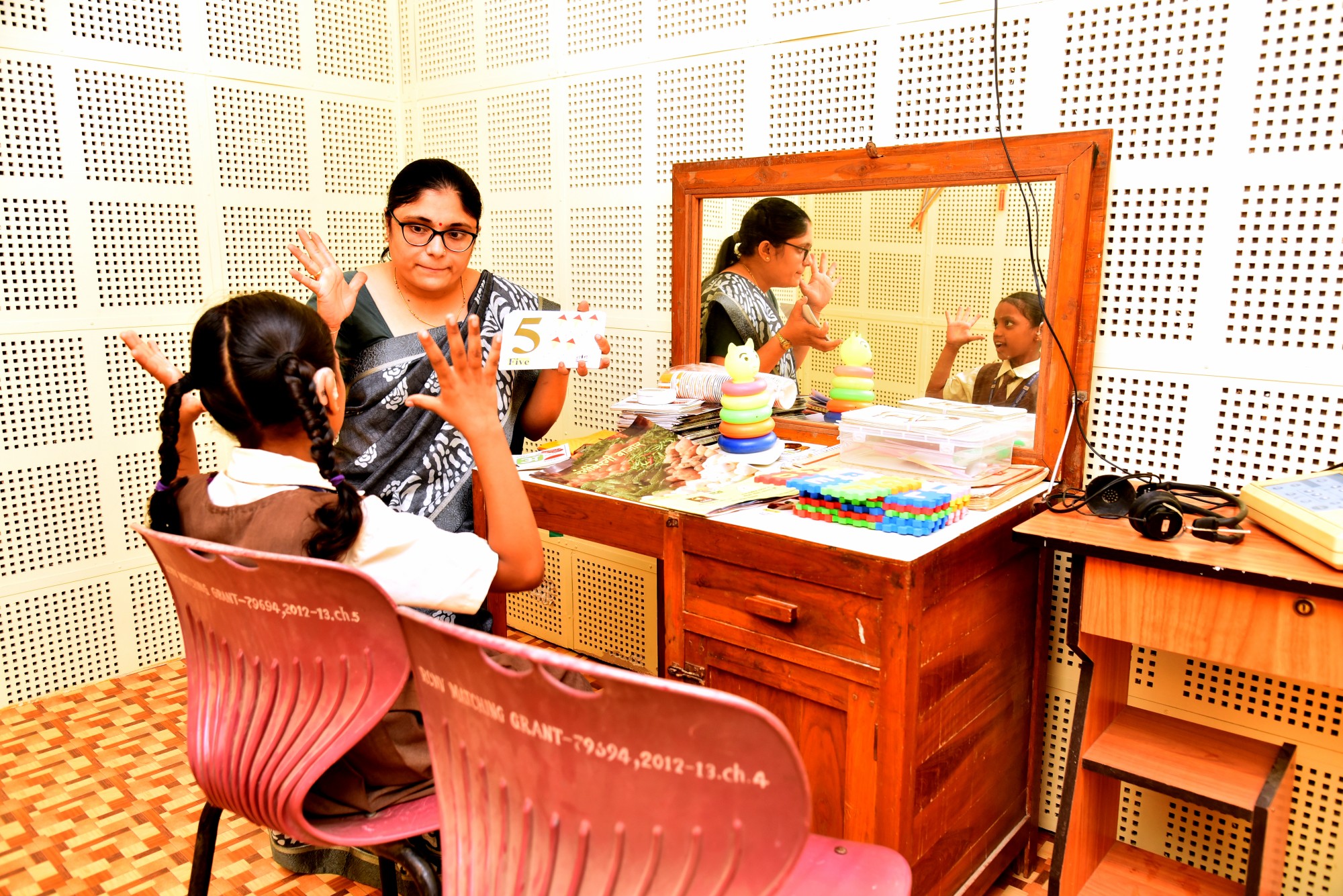 Speech Therapy Teacher Guiding a Student